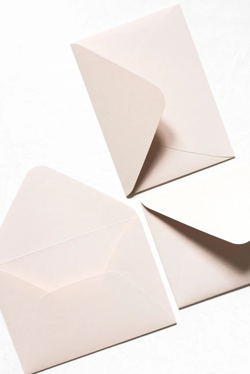 An overhead view of unsealed envelopes with triangular seal flaps.