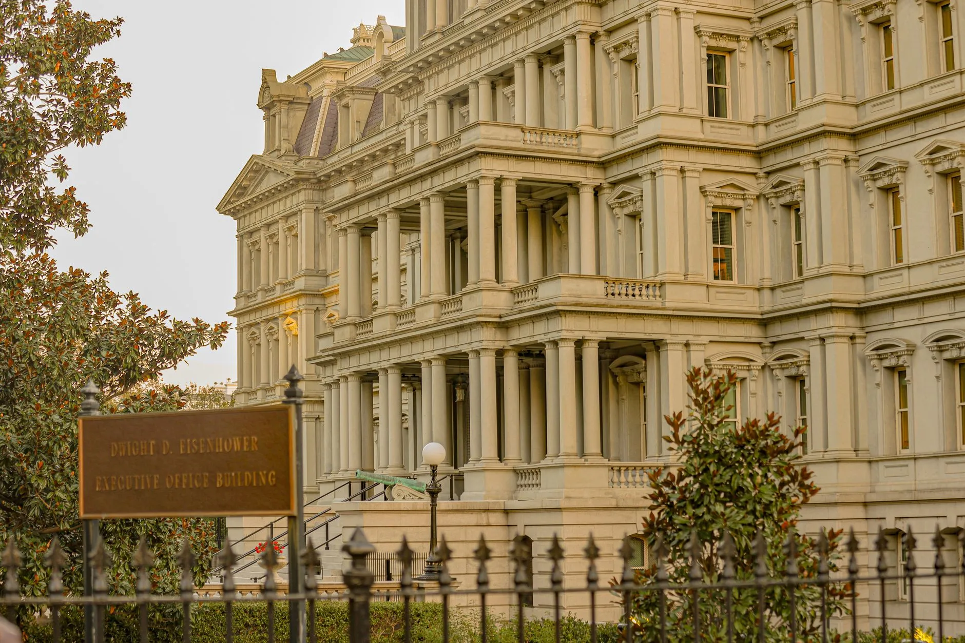 The front facade of a grand Second Empire style government building.