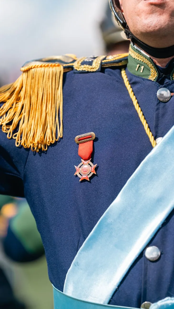 A close-up of a military uniform with a medal.