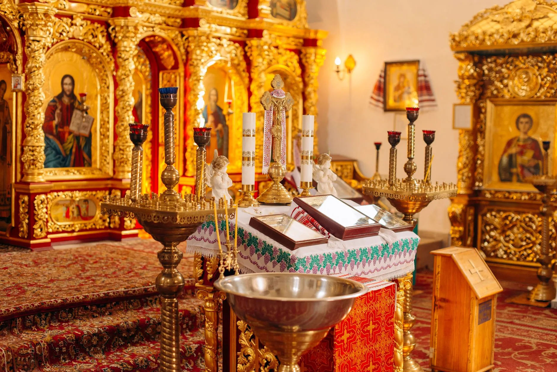 A richly decorated Eastern Orthodox church altar with religious icons.