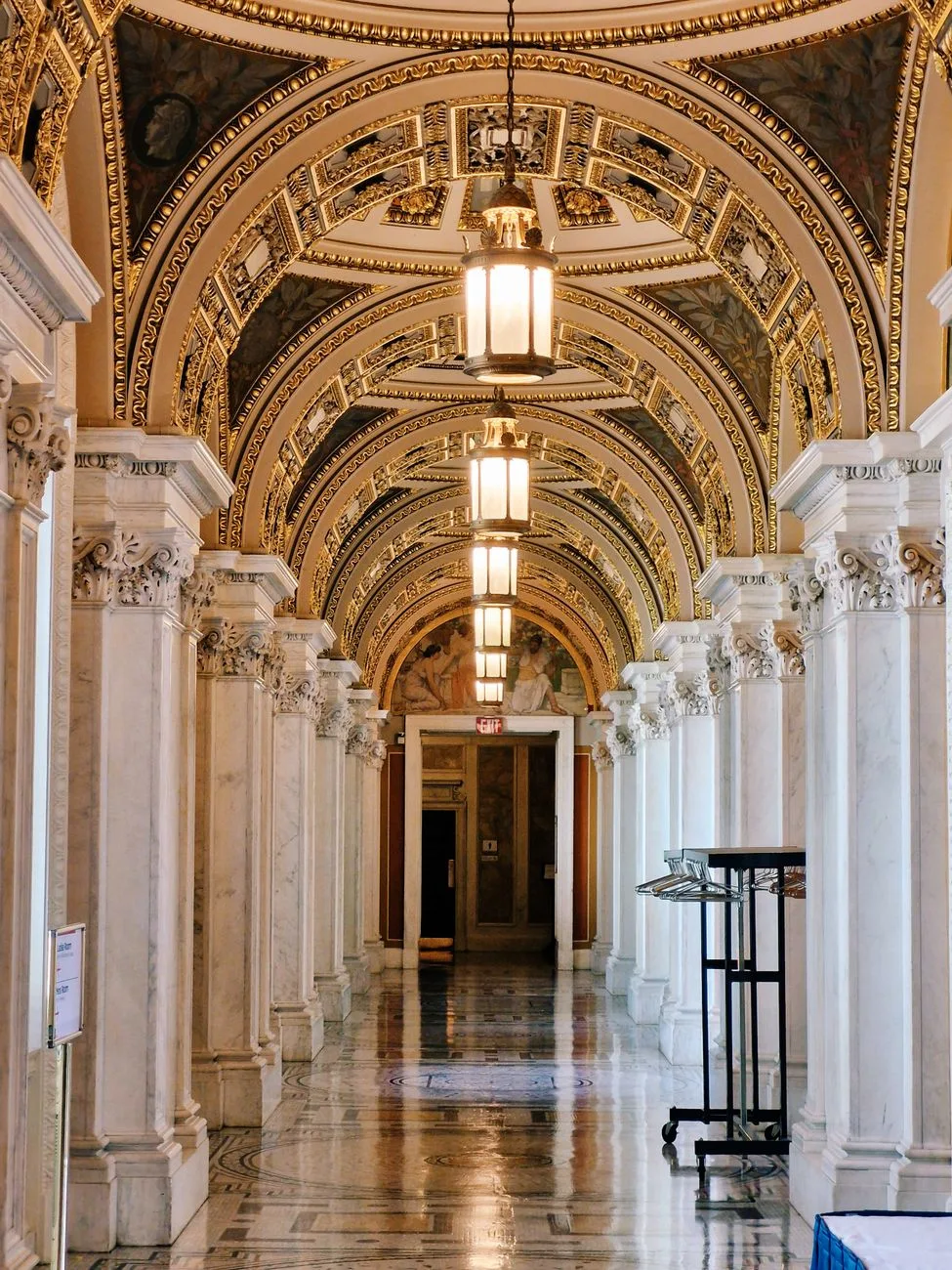An ornate corridor inside a government building in Washington, DC.