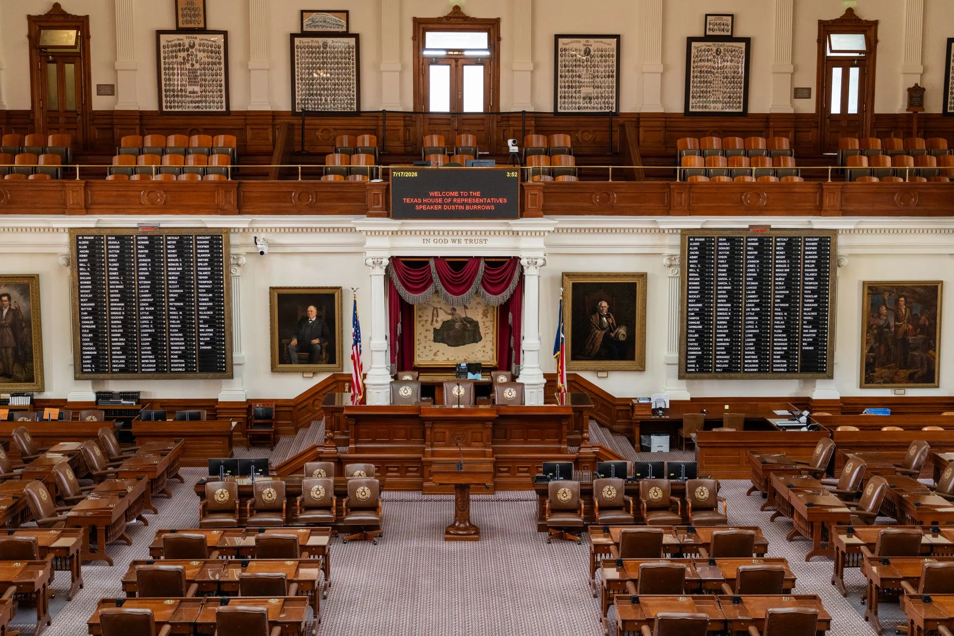 The ornate interior of a state house of representatives chamber.