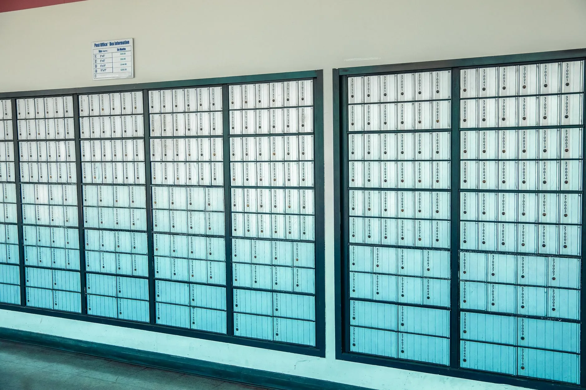 Rows of mailboxes inside a post office.